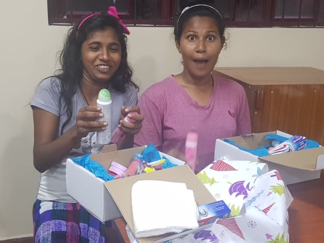 Two very surprised girls with their Christmas presents!